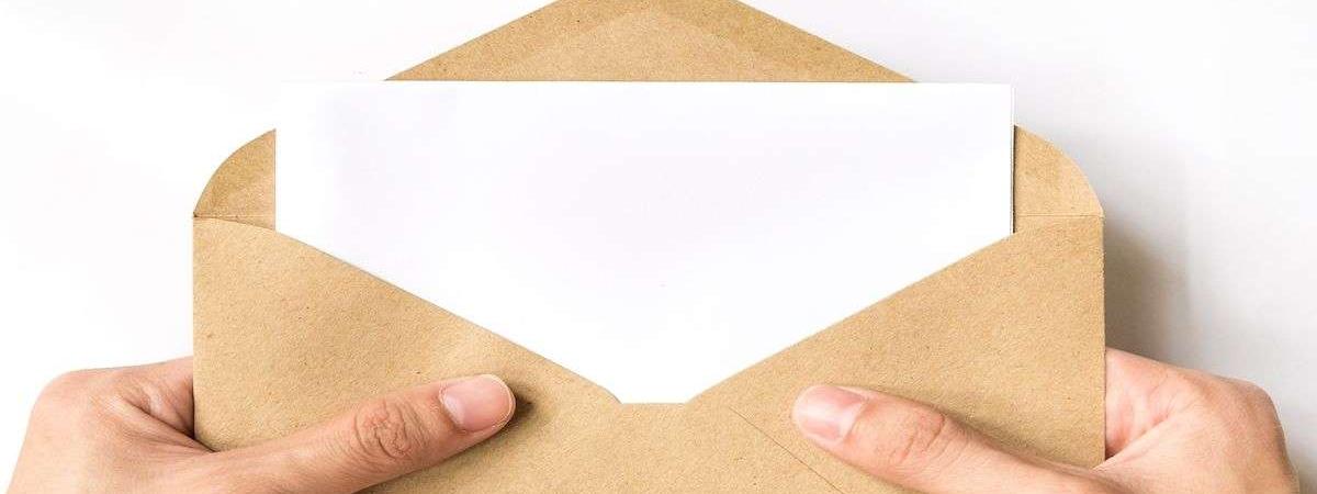 envelope with letter sticking out for direct mail marketing strategy