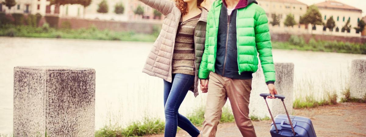 family walking by a river while looking for real estate in February