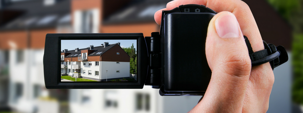 real estate agent creating a virtual tour of a property with a video camera