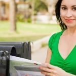 woman receiving her direct mail marketing campaign in march